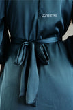 Blue satin flare modest gown from YEZWE featuring a stylish tied waist for a flattering fit