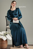 YEZWE blue satin flare modest gown with long sleeves and a sleek silhouette, styled with a clutch