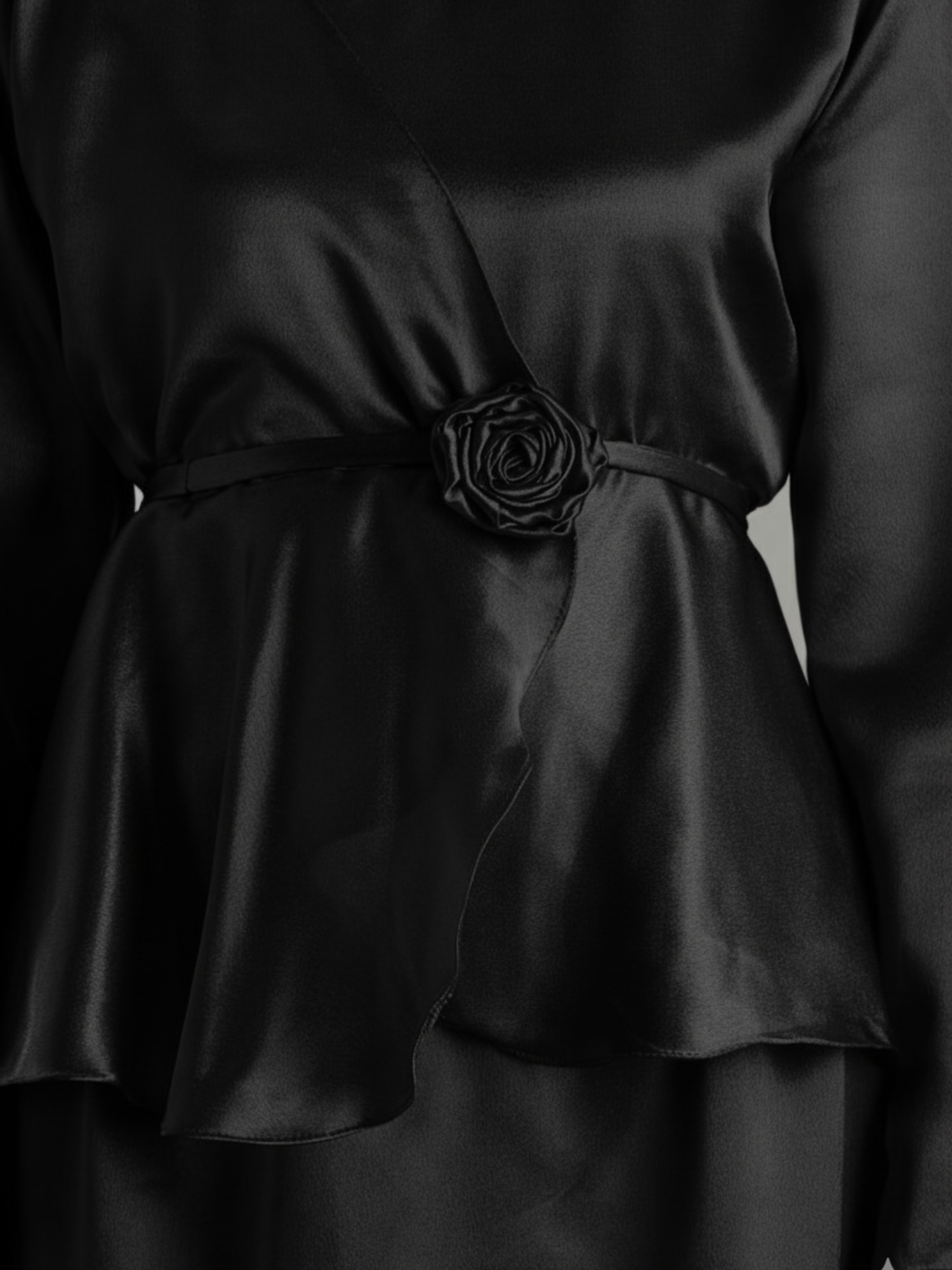 Elegant black Yezwe Co-Ord Set featuring a stylish peplum design with a rose detail