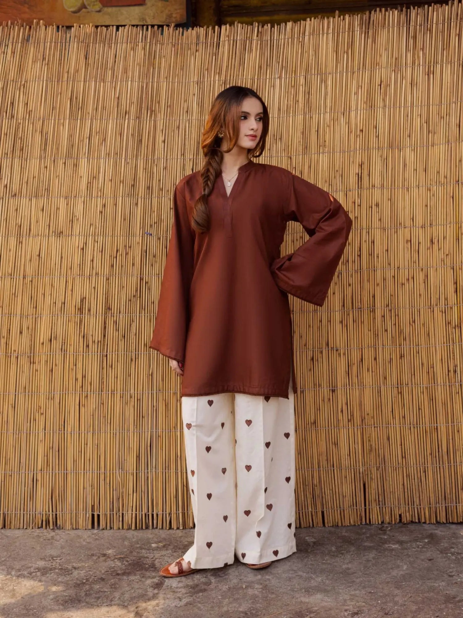 YEZWE women's co-ord set featuring a brown top with bell sleeves and heart-patterned cream pants