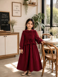 Young girl wearing a maroon bow detail maxi dress with long sleeves and flared skirt, perfect for party wear and festive occasions