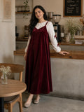 Maroon Velvet Sleeveless Gown with Knitted Inner | Modest Maxi Dress for Women styled in a cozy cafe setting