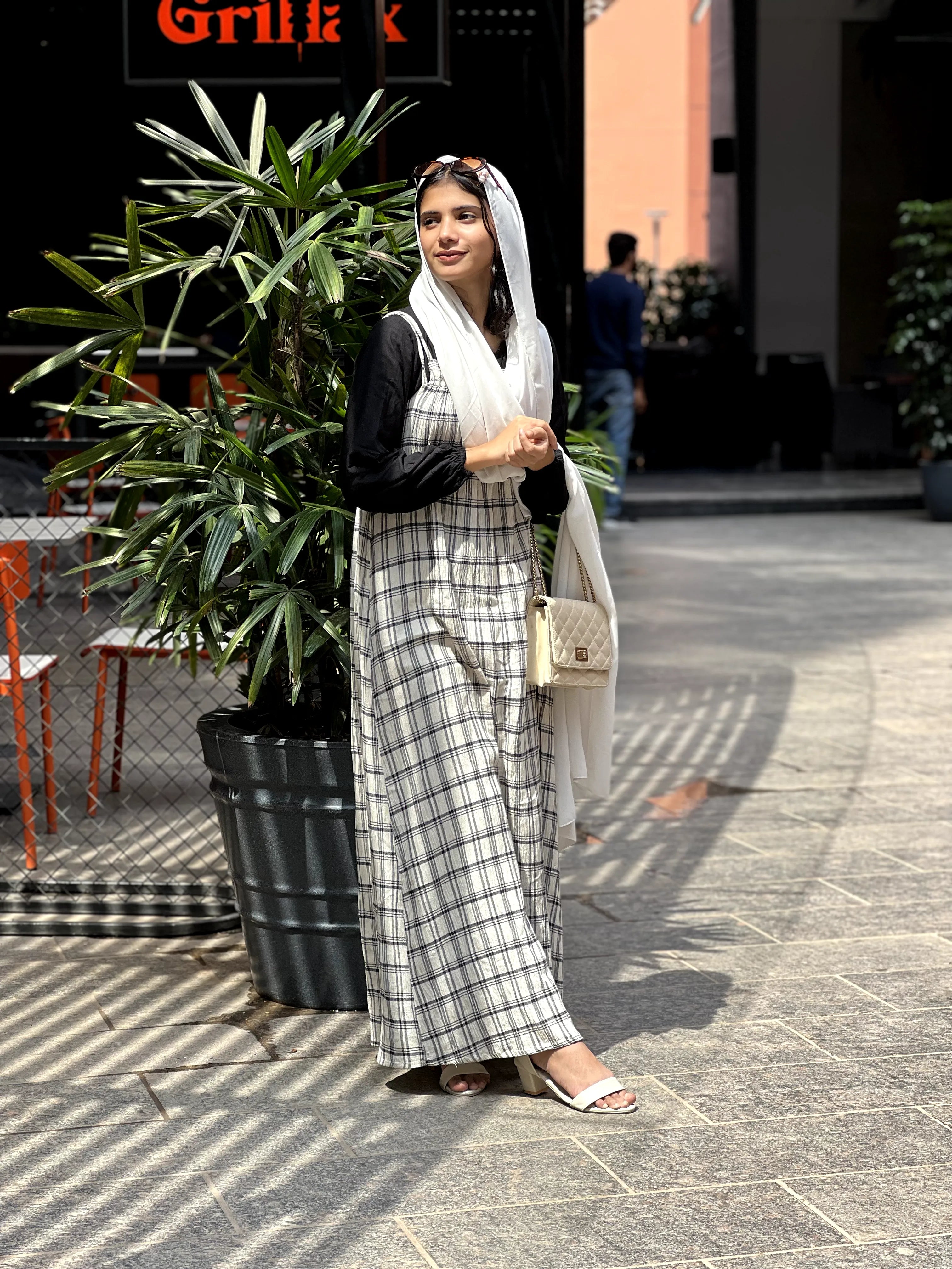 Yezwe modest dungaree dress in black and white plaid, perfect for stylish casual occasions