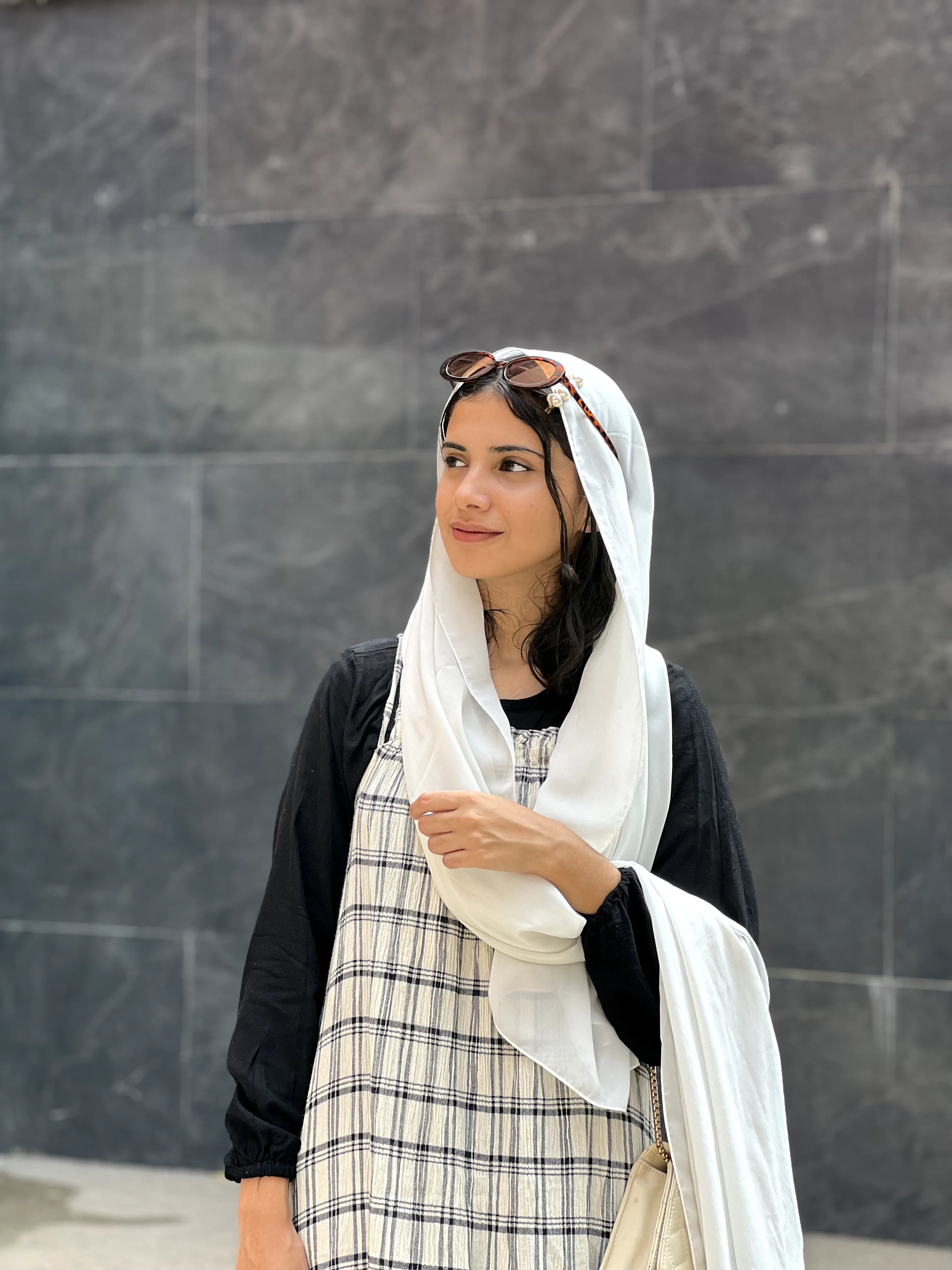 Yezwe modest dungaree dress with a stylish checkered pattern, paired with a lightweight scarf