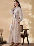 Modest long sleeve maxi dress by YEZWE featuring a floral pattern and cinched waist