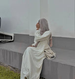 Modest off white maxi dress by Yezwe, featuring a flowing design and elegant silhouette