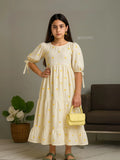 Young girl wearing modest love embroidered maxi dress in ivory kora