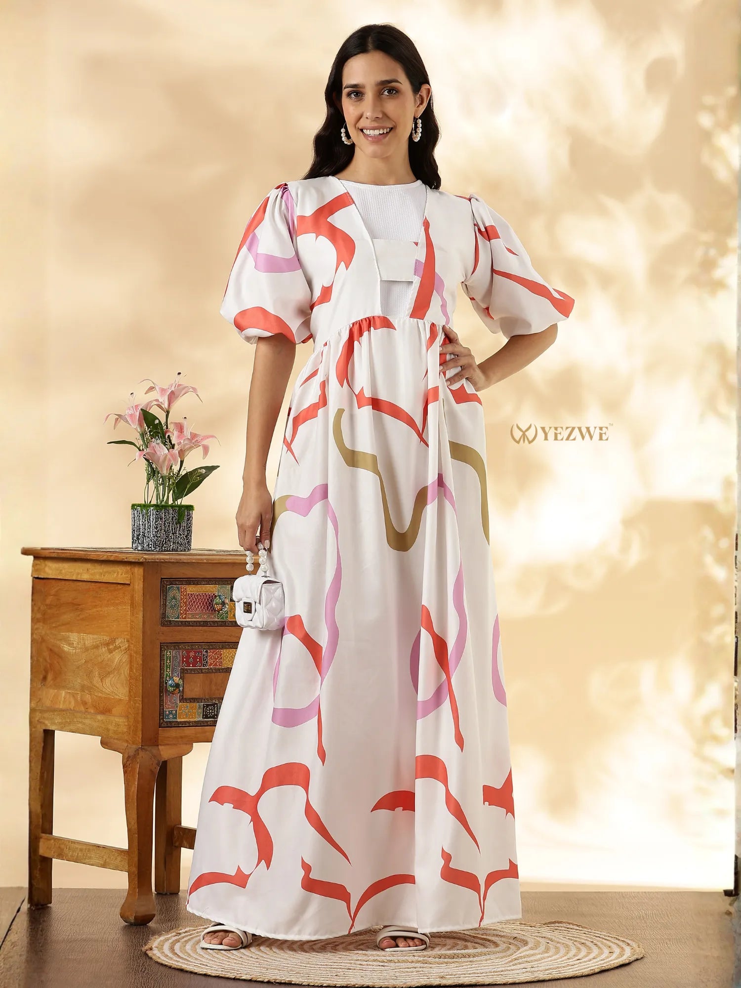 Imported Modest Maxi Dress by YEZWE featuring colorful patterns and puff sleeves on a model