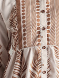 Close-up of Yezwe junior girl miniature brown feather maxi dress with button front and detailed feather print