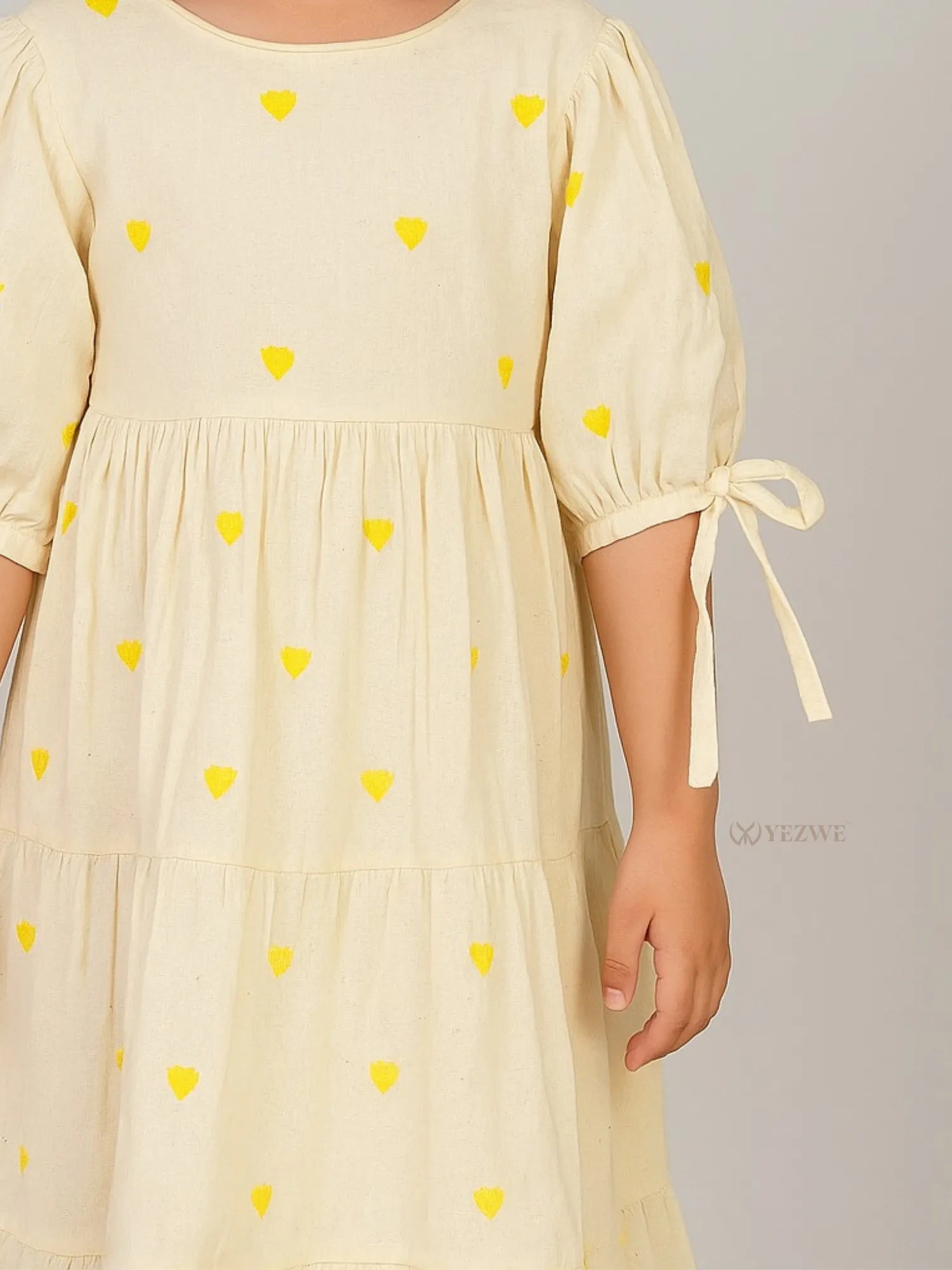 close shot of sleeve tye and embridery in Miniature Yellow Love Embroidered Kora Modest Maxi Dress For Junior Girls
