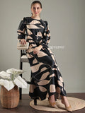 Black abstract print modest maxi dress by YEZWE, featuring a stylish belt and elegant long sleeves