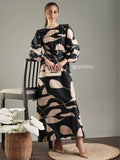 Elegant black abstract print modest maxi dress by YEZWE, featuring puff sleeves and a cinched waist