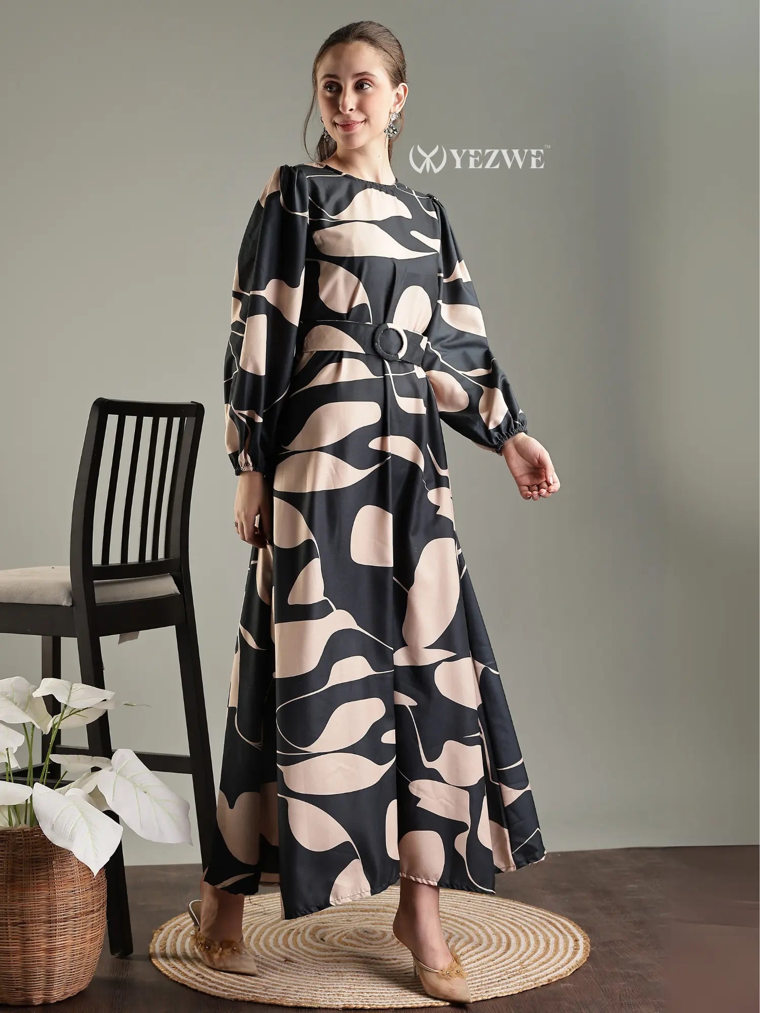 Elegant black abstract print modest maxi dress by YEZWE, featuring a belt and long sleeves