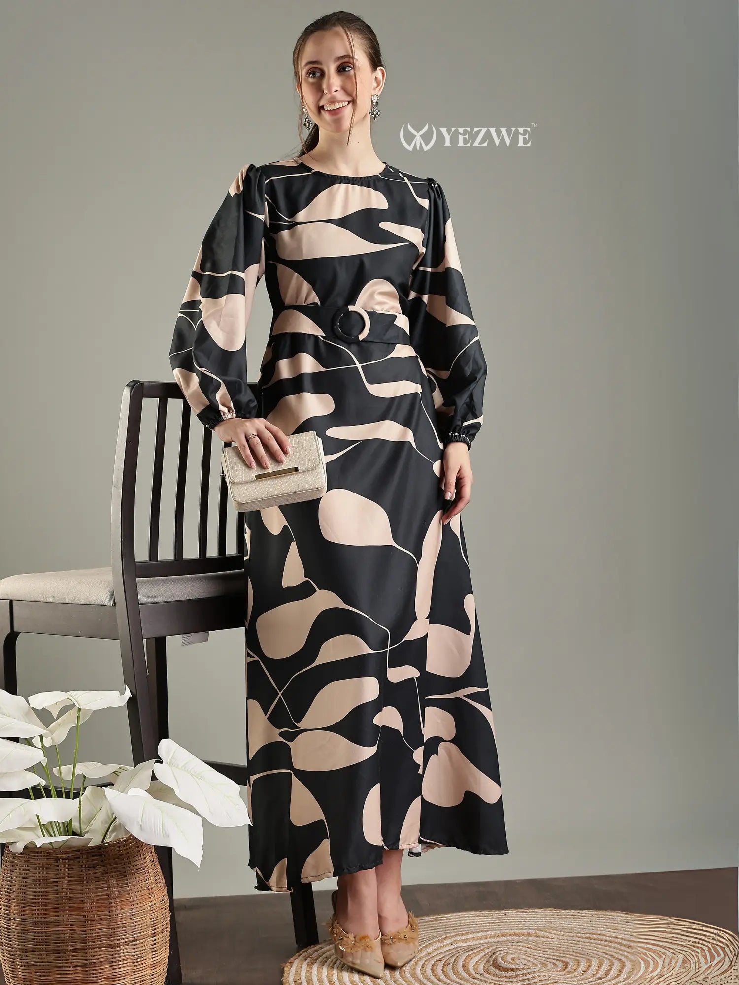 Black abstract print modest maxi dress designed by YEZWE with elegant long sleeves and stylish silhouette