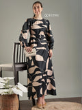 Black abstract print modest maxi dress designed by YEZWE with elegant long sleeves and stylish silhouette