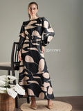 YEZWE black abstract print modest maxi dress with balloon sleeves and a cinched waist