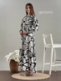 YEZWE Black And White Floral Full length Modest Maxi Dress featuring long sleeves and a flowy design