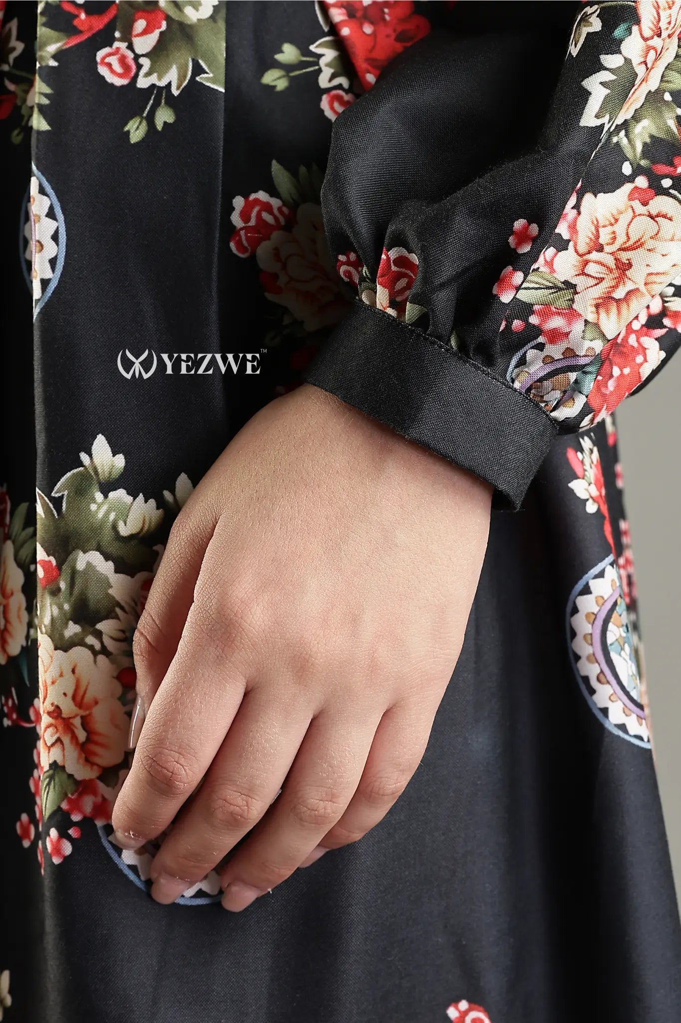 Close-up of YEZWE Black Floral Maxi Dress sleeve with elegant floral patterns