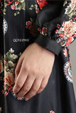 Close-up of YEZWE Black Floral Maxi Dress sleeve with elegant floral patterns