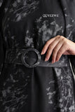 Close-up of YEZWE black floral print belted modest maxi dress highlighting the stylish belt and fabric details