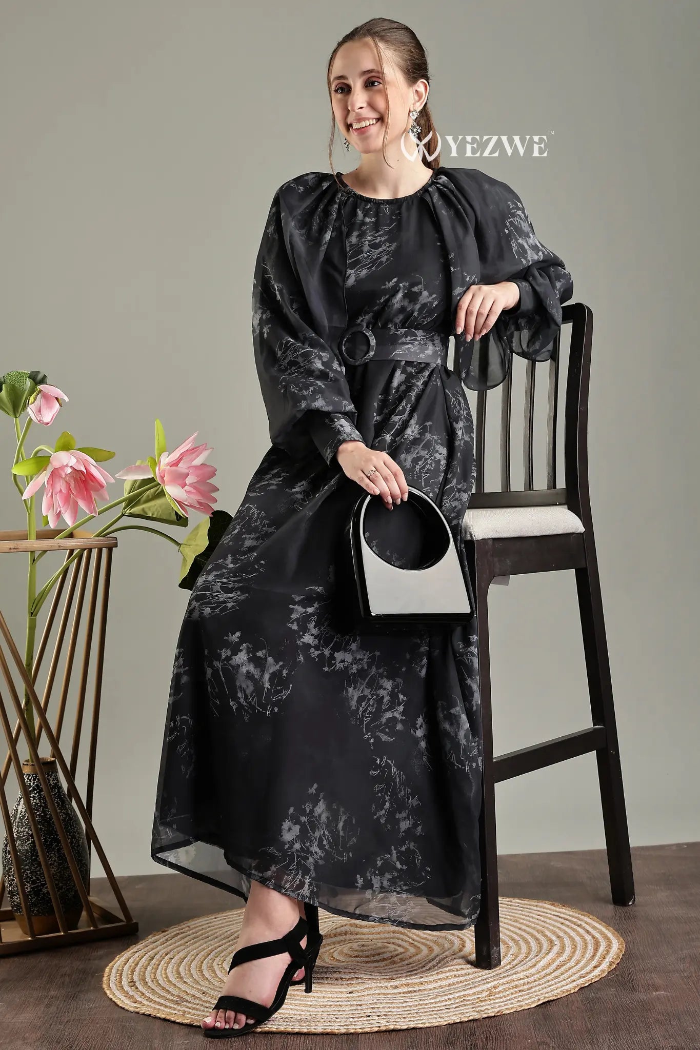 Black floral print belted modest maxi dress by YEZWE, designed for elegant and comfortable wear.