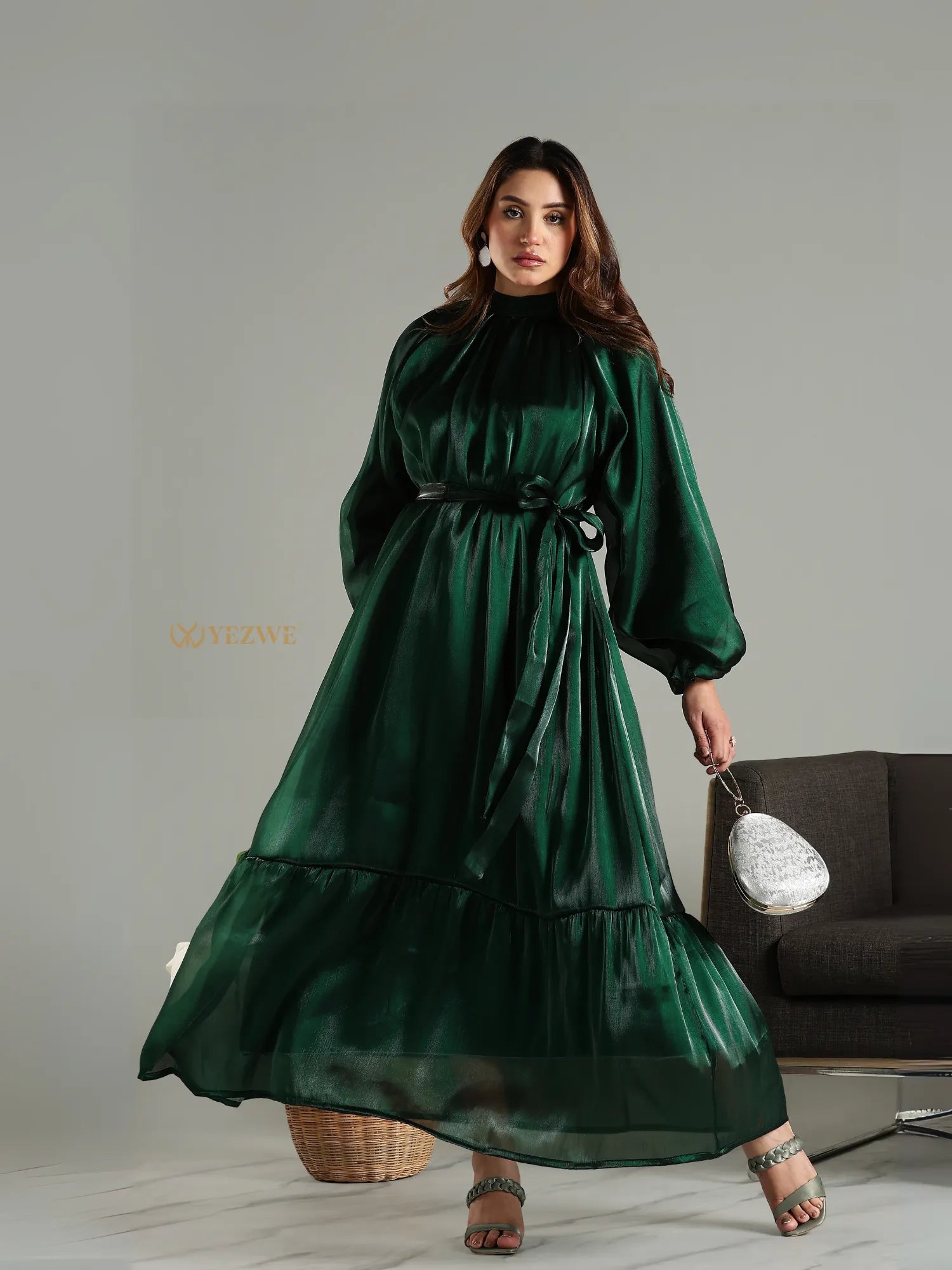 Yezwe emerald green modest maxi dress with long sleeves and waist tie belt on model
