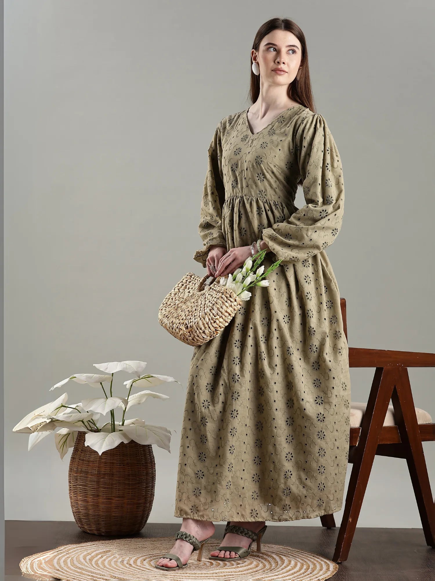 YEZWE full length long sleeved hakoba maxi dress in olive green with floral patterns and a cinched waist