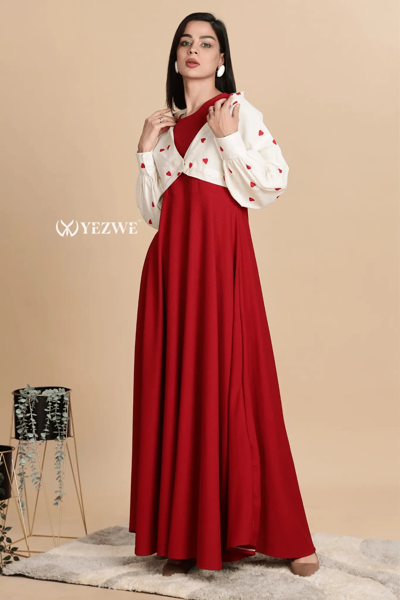 Brilliant knitted red maxi dress with shrug, featuring a stylish cut and heart-patterned sleeve details