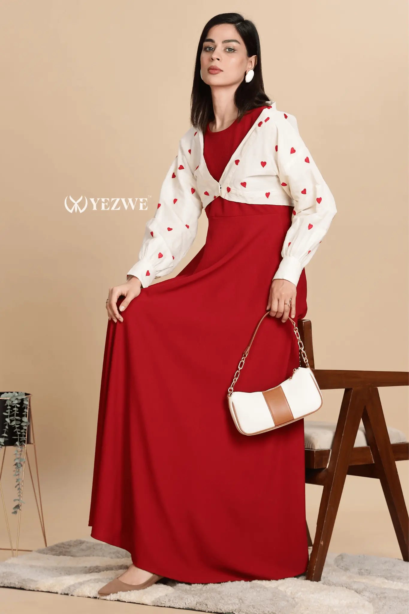 Stylish knitted red maxi dress with shrug and playful heart patterns, perfect for casual outings