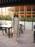 YEZWE long tunic with pant co-ord set featuring beige fabric with black polka dots worn by model outdoors
