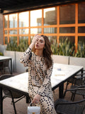 YEZWE co-ord set featuring a beige long tunic with pant in black polka dots, styled outdoor casual wear