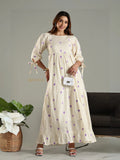 Yezwe beige maxi dress with purple heart pattern and tied sleeves worn by smiling woman