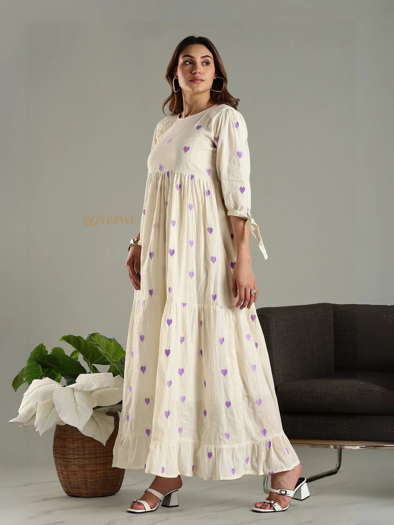 Yezwe cream maxi dress with purple heart prints  sleeves and ruffled hem worn with white heels