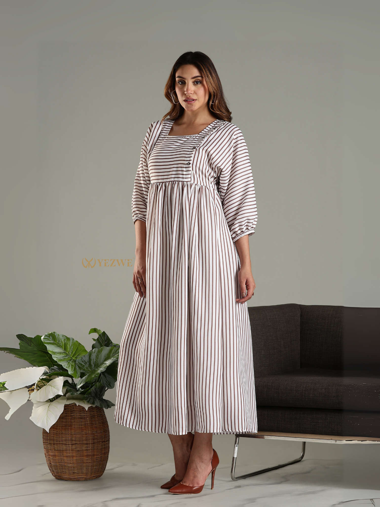 Yezwe striped maxi dress with long sleeves and square neckline worn by a model