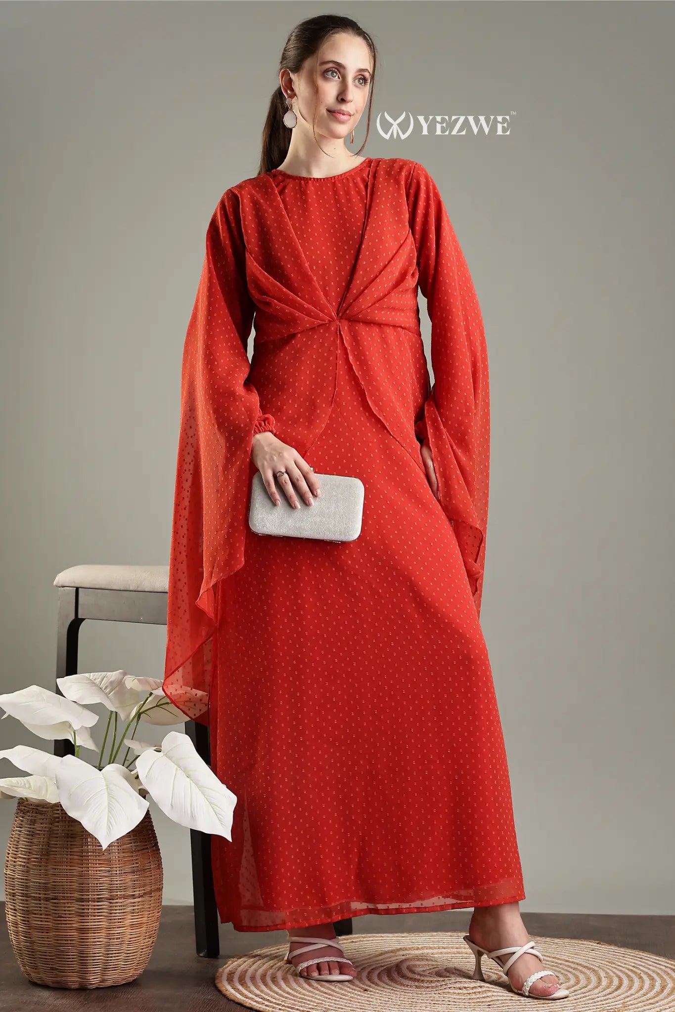 Modest in orange georgette maxi dress with long sleeves and elegant draping style by YEZWE