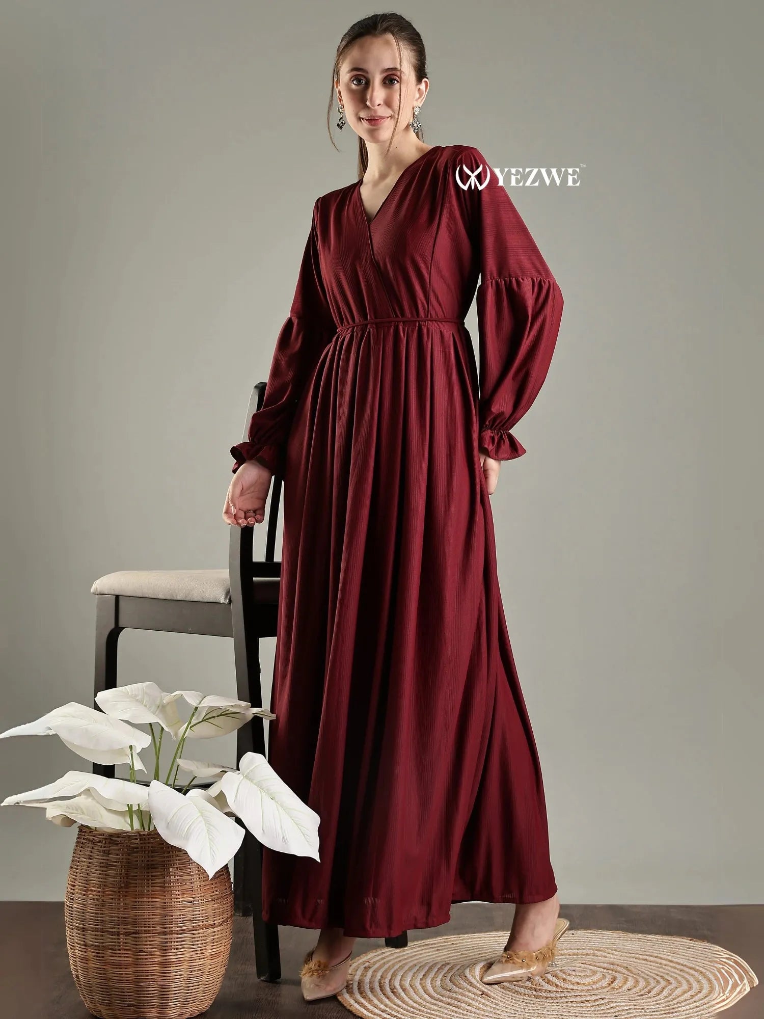 Modest long sleeve maxi maroon dress by YEZWE featuring a flattering V-neck and flowing silhouette