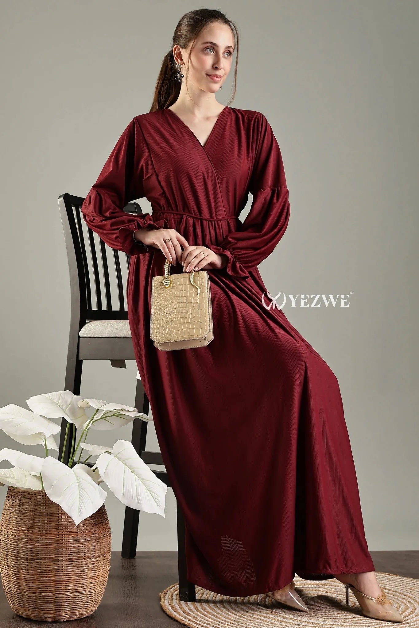 Modest long sleeve maxi maroon dress by YEZWE with a flattering waistline and elegant sleeves