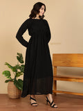 YEZWE Modest Maxi Dress black pleated long sleeve maxi dress on model with strappy heels