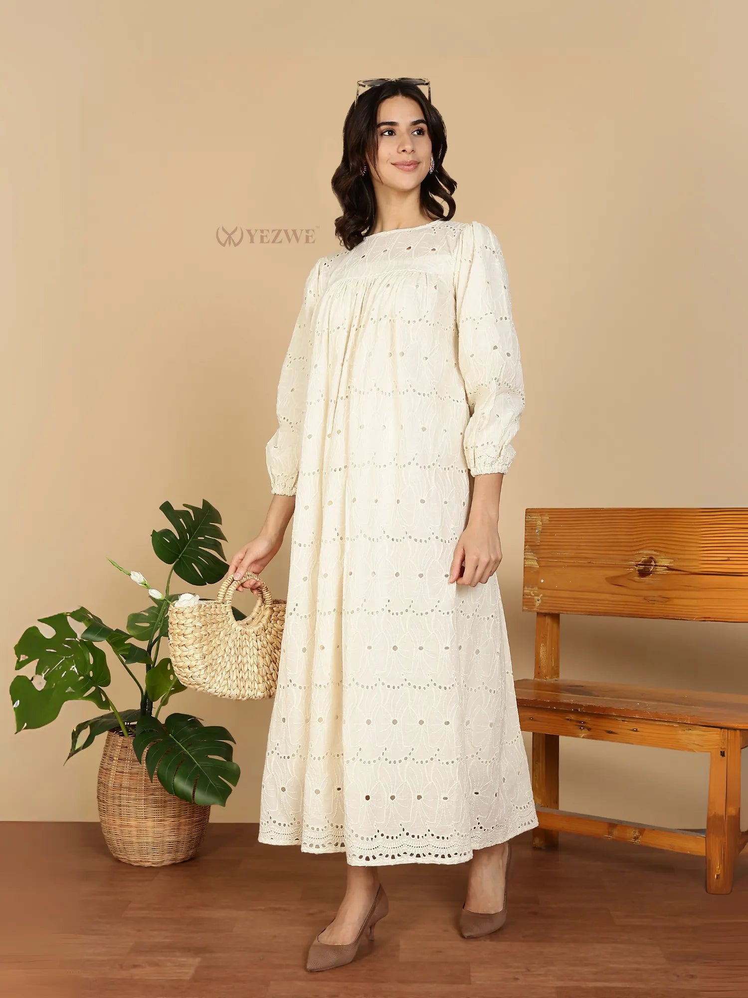 YEZWE Modest Maxi Dress cream eyelet cotton with long puff sleeves round neckline styled with straw bag