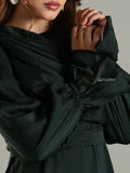 Yezwe modest maxi dress in dark fabric with gathered sleeves and elegant draping detail