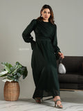 Yezwe modest maxi dress in dark green with long sleeves and a cinched waist worn with heels