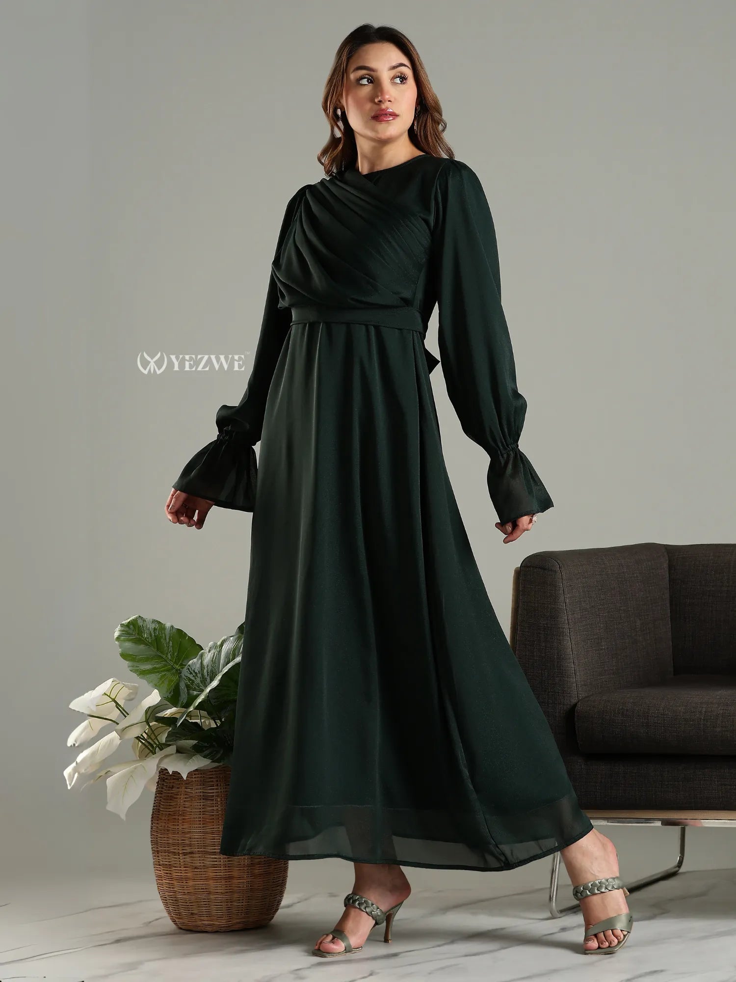 Yezwe modest maxi dress in dark green with long puffed sleeves and flowing skirt