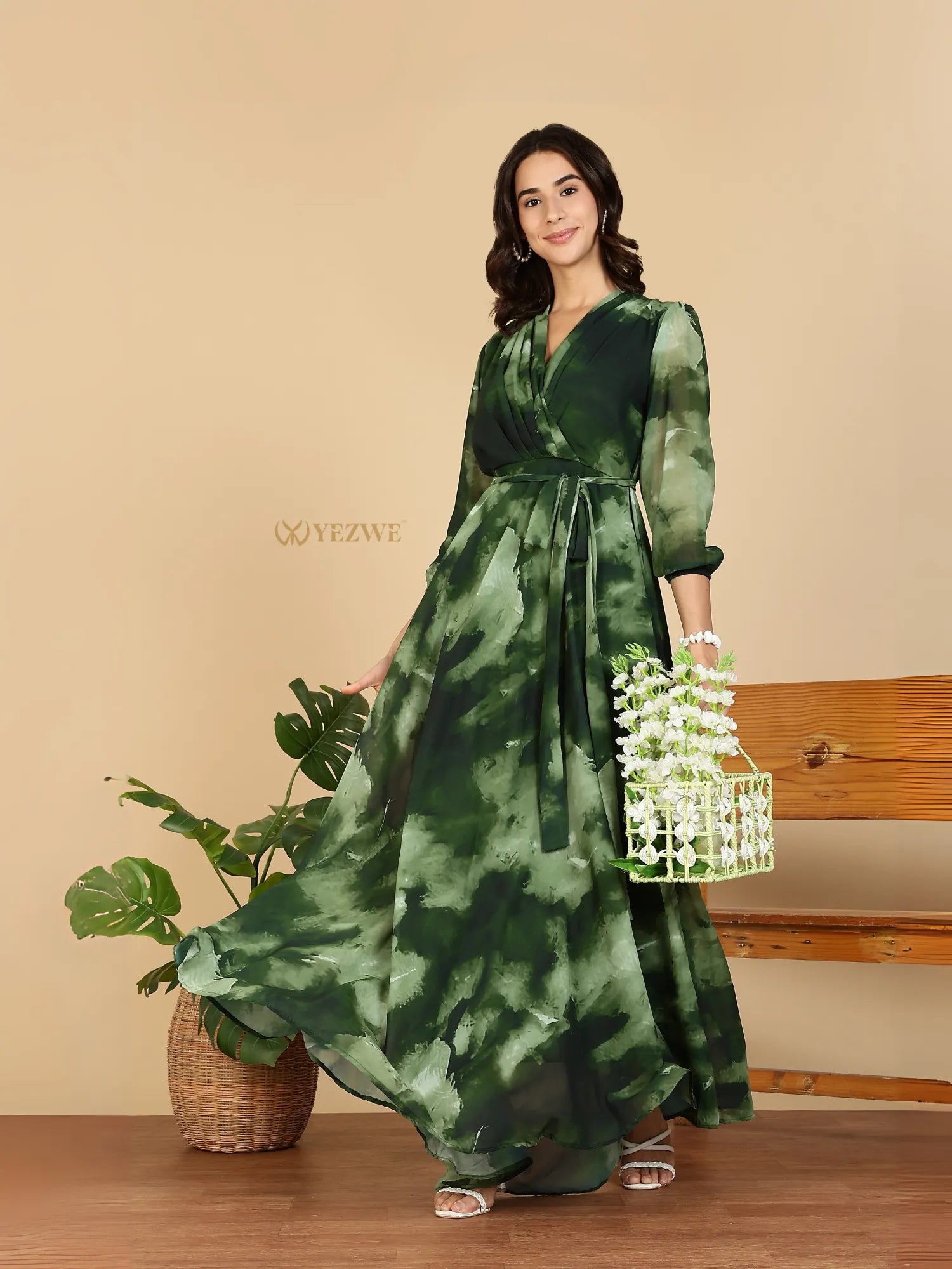 Yezwe Modest Maxi Dress green watercolor wrap with sash belt three quarter sleeves flowing skirt model holding floral basket