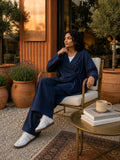 YEZWE Navy Blue Wrap Top and Wide Leg Pants Modest Co-ord Set worn by a woman in a stylish outdoor setting
