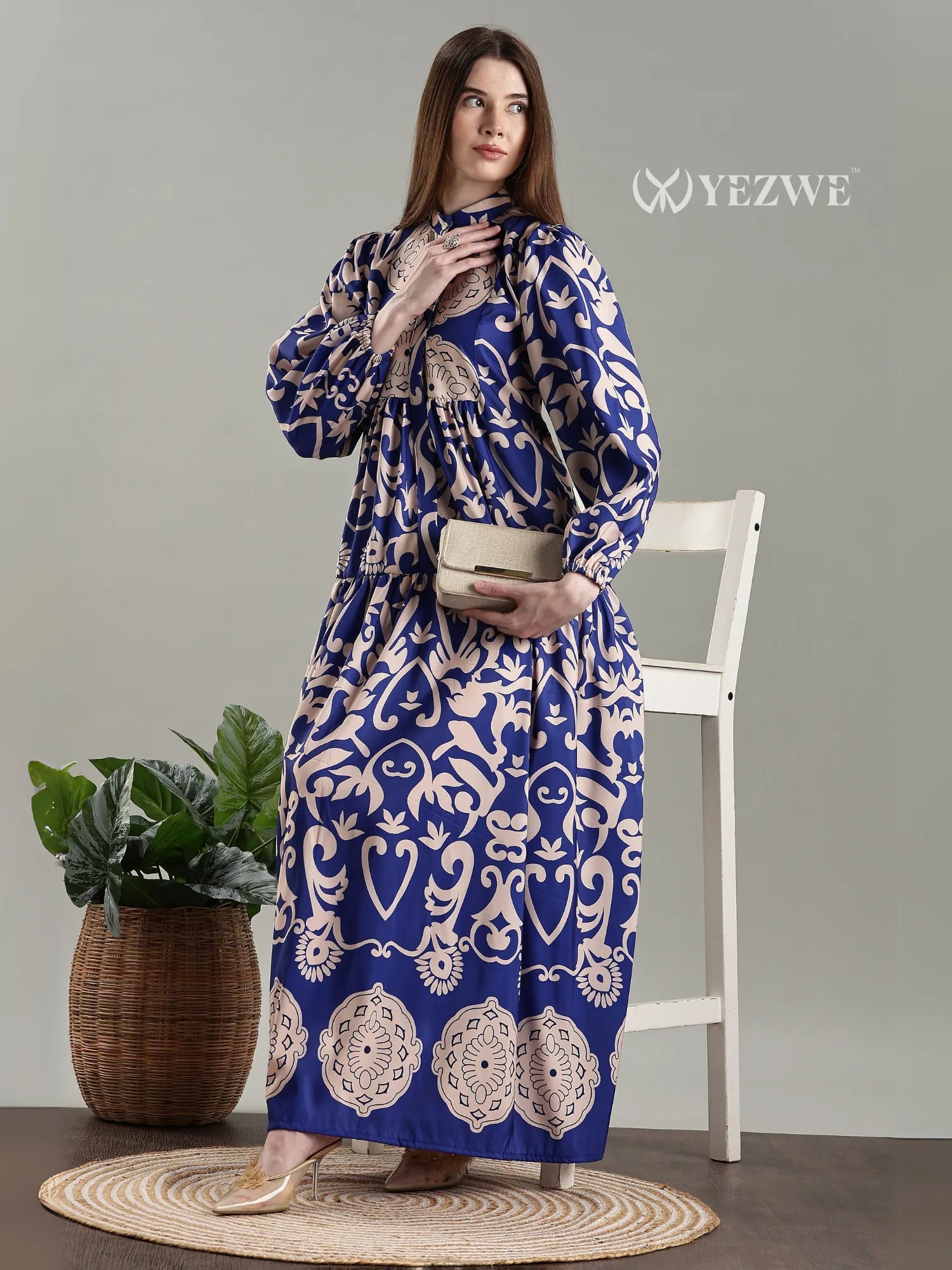 YEZWE Royal Blue Printed Full Length Modest Maxi Dress styled elegantly with a clutch and accessories