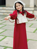 young girl wearing wine maroon modest maxi dress with a cream layered top playing and smiling outdoors in a candid pose