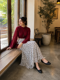 YEZWE Wine Red Fusion Mock-Neck Top & Polka Dot Co-ord Style Co ord with flowing skirt in a cozy café setting