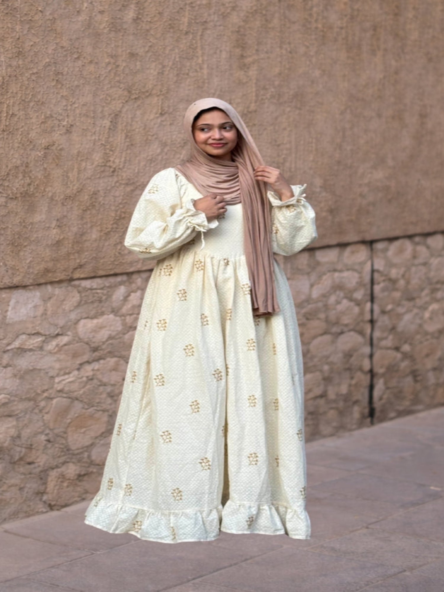 Ivory full-length modest dress with delicate Kora embroidery and flowy silhouette.