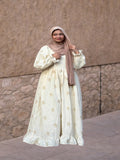 Ivory full-length modest dress with delicate Kora embroidery and flowy silhouette.