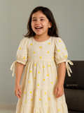A girl in Yezwe Miniature Yellow Love Embroidered Kora Modest Maxi Dress For Junior Girls laughing 